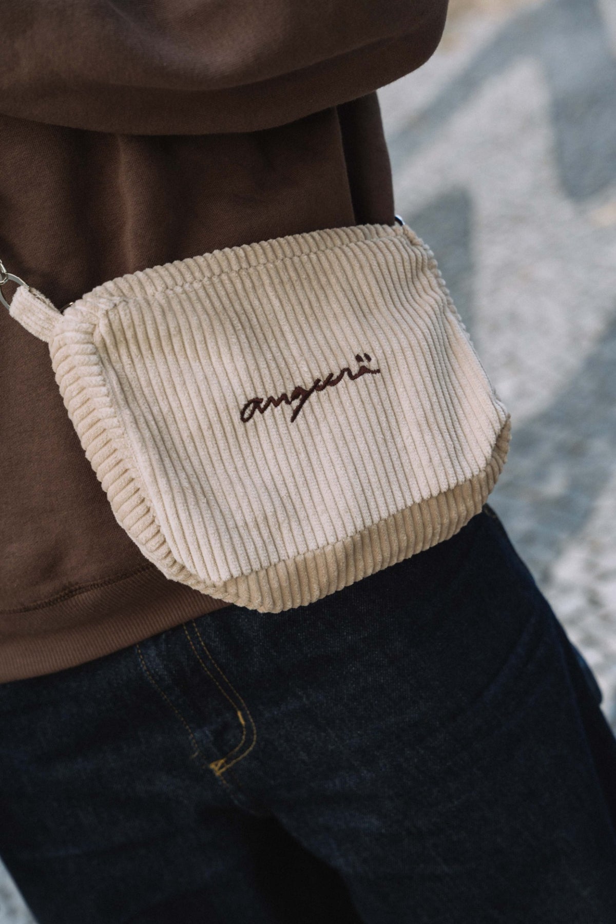 Cream corduroy crossbody bag, front view with brown angurä embroidery