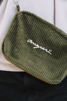 Khaki corduroy crossbody bag, front view with white angurä embroidery