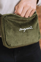 Khaki corduroy crossbody bag, close-up of white angurä embroidery